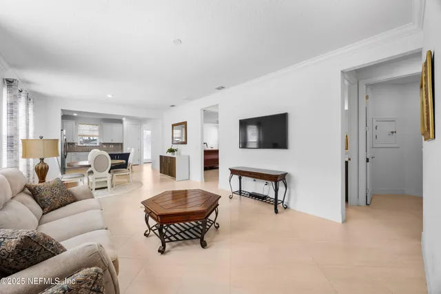 a living room with furniture and a window
