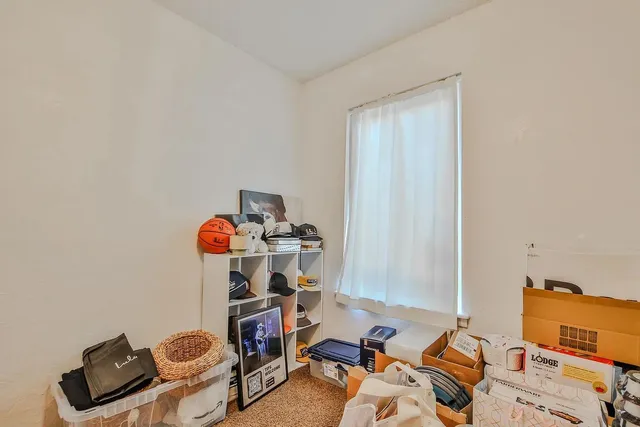 a room with furniture and gym equipment