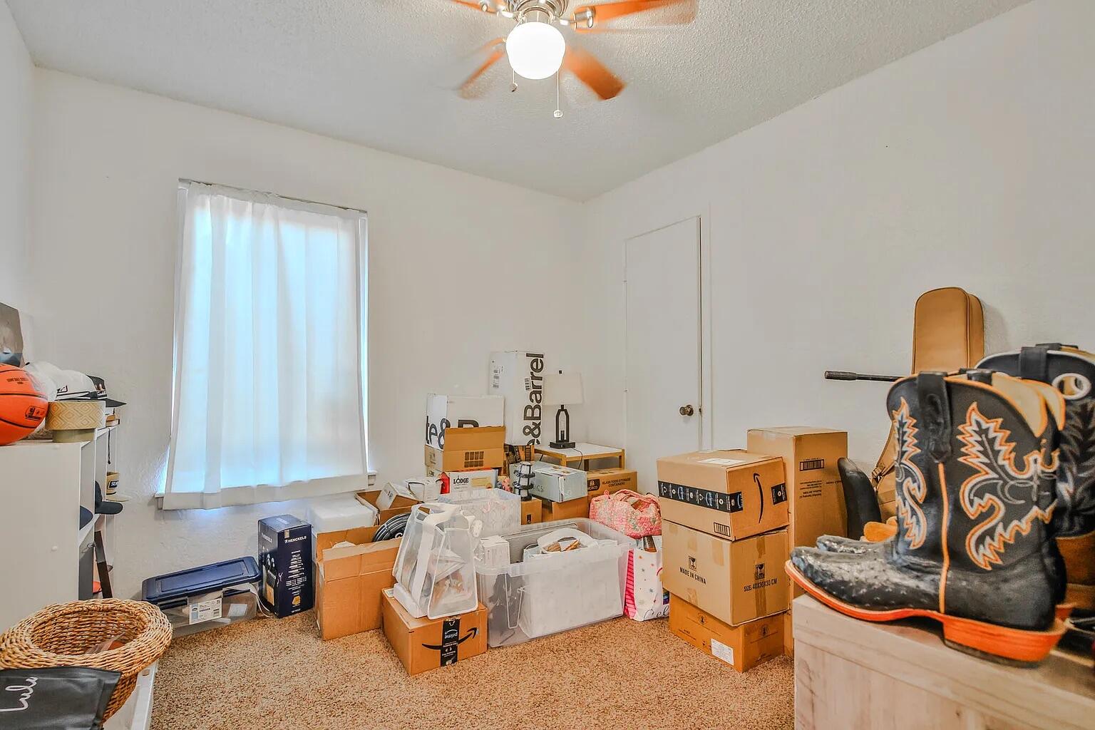 5708 3rd Street Lubbock, TX 79416 - Photo 14 of 23 a room with furniture and musical instruments