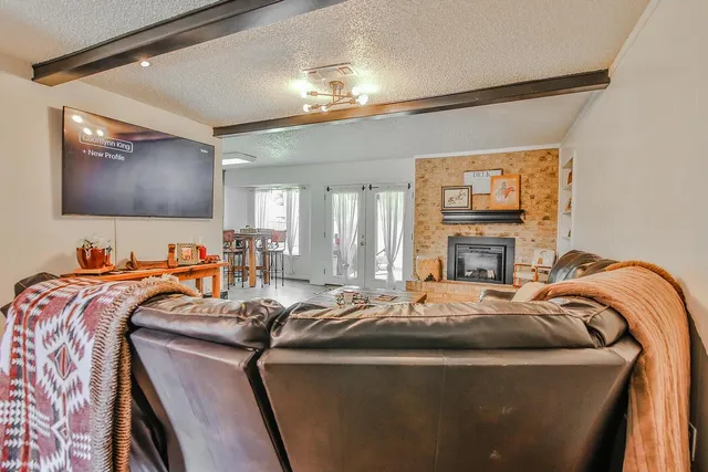 a bed room with a bed and a television