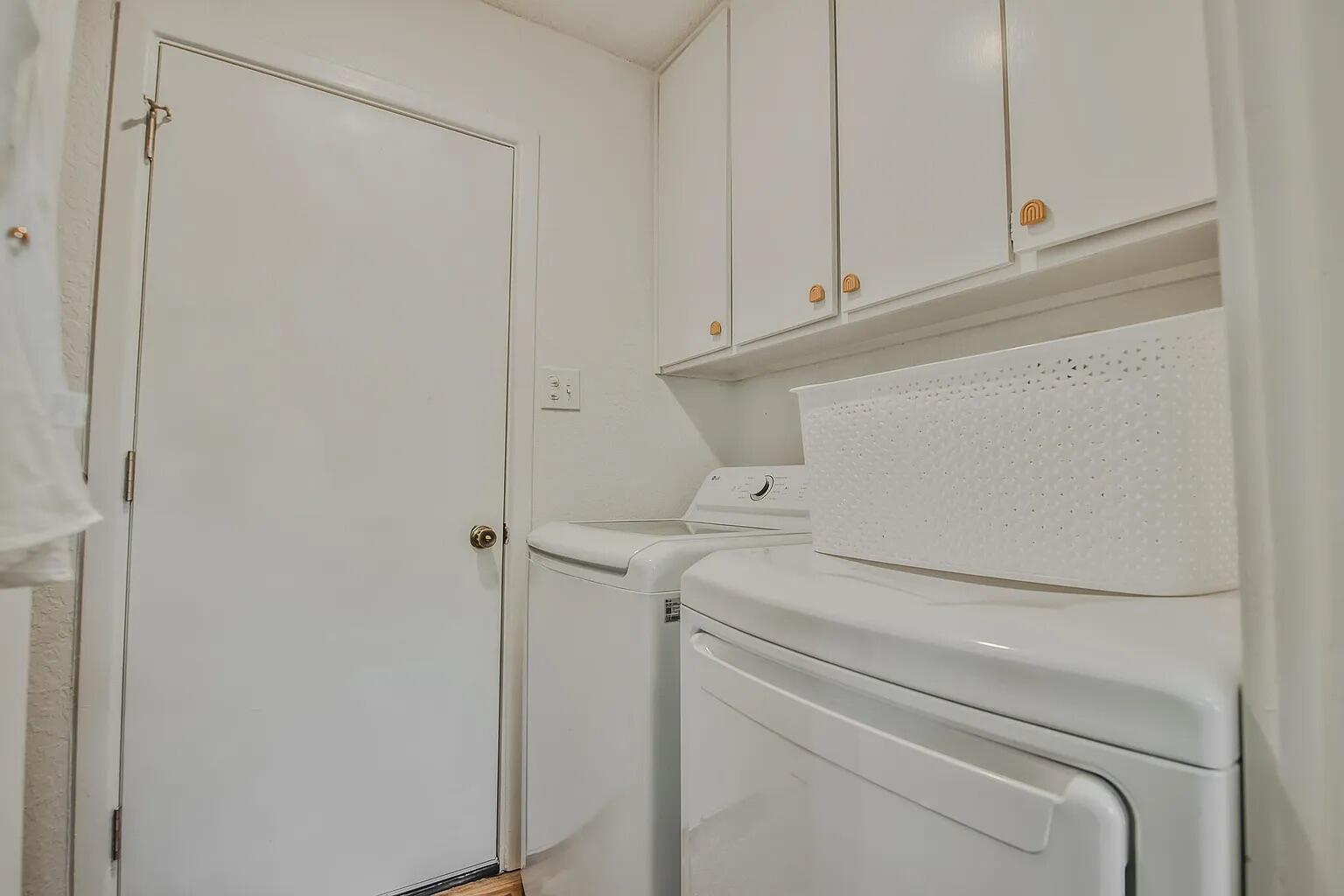 5708 3rd Street Lubbock, TX 79416 - Photo 20 of 23 a utility room with dryer and washer