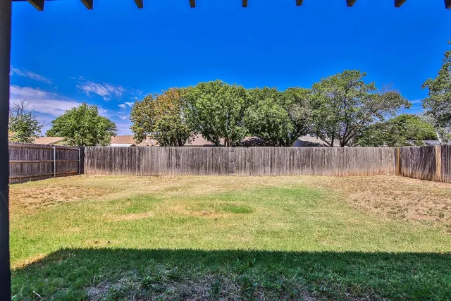 a view of a backyard with green space