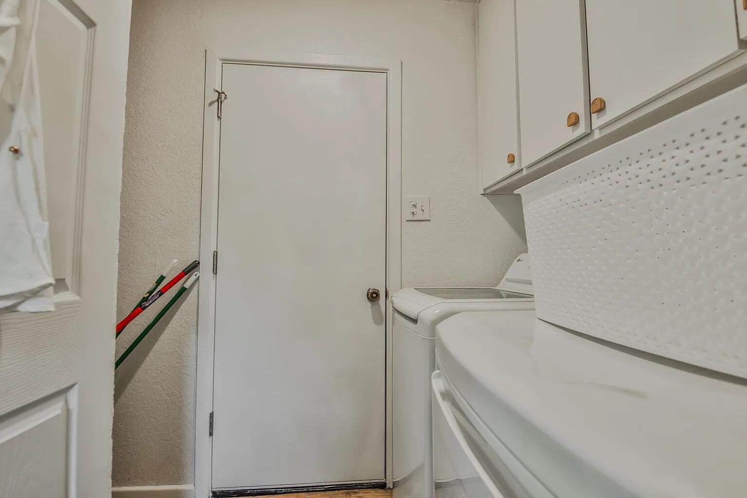 5708 3rd Street Lubbock, TX 79416 - Photo 8 of 23 a bathroom with a bathtub and a shower