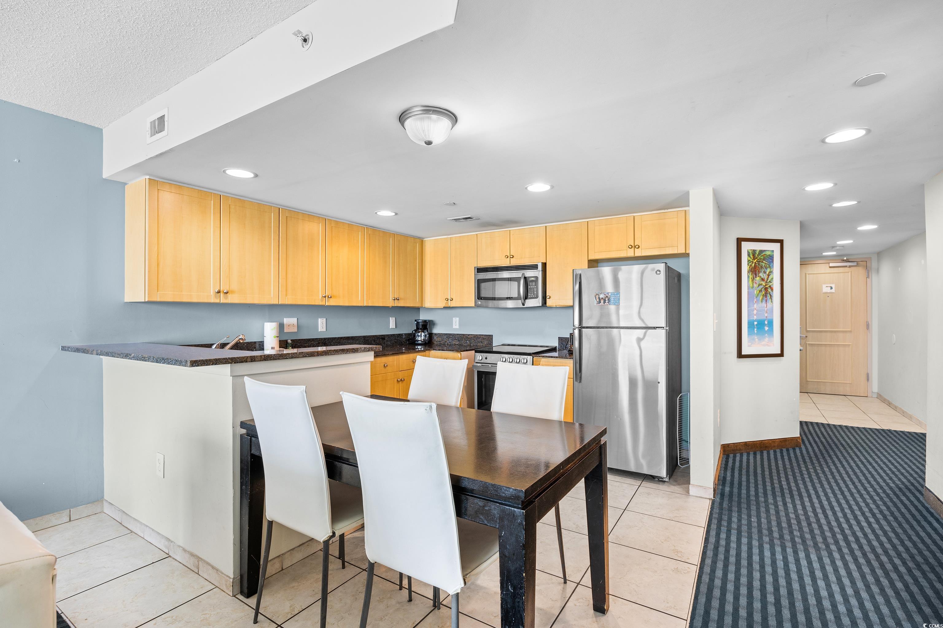 107 Ocean Boulevard, Unit 1402 Myrtle Beach, SC 29577 - Photo 2 of 38 Kitchen featuring recessed lighting, stainless steel appliances, light brown cabinets, and visible vents