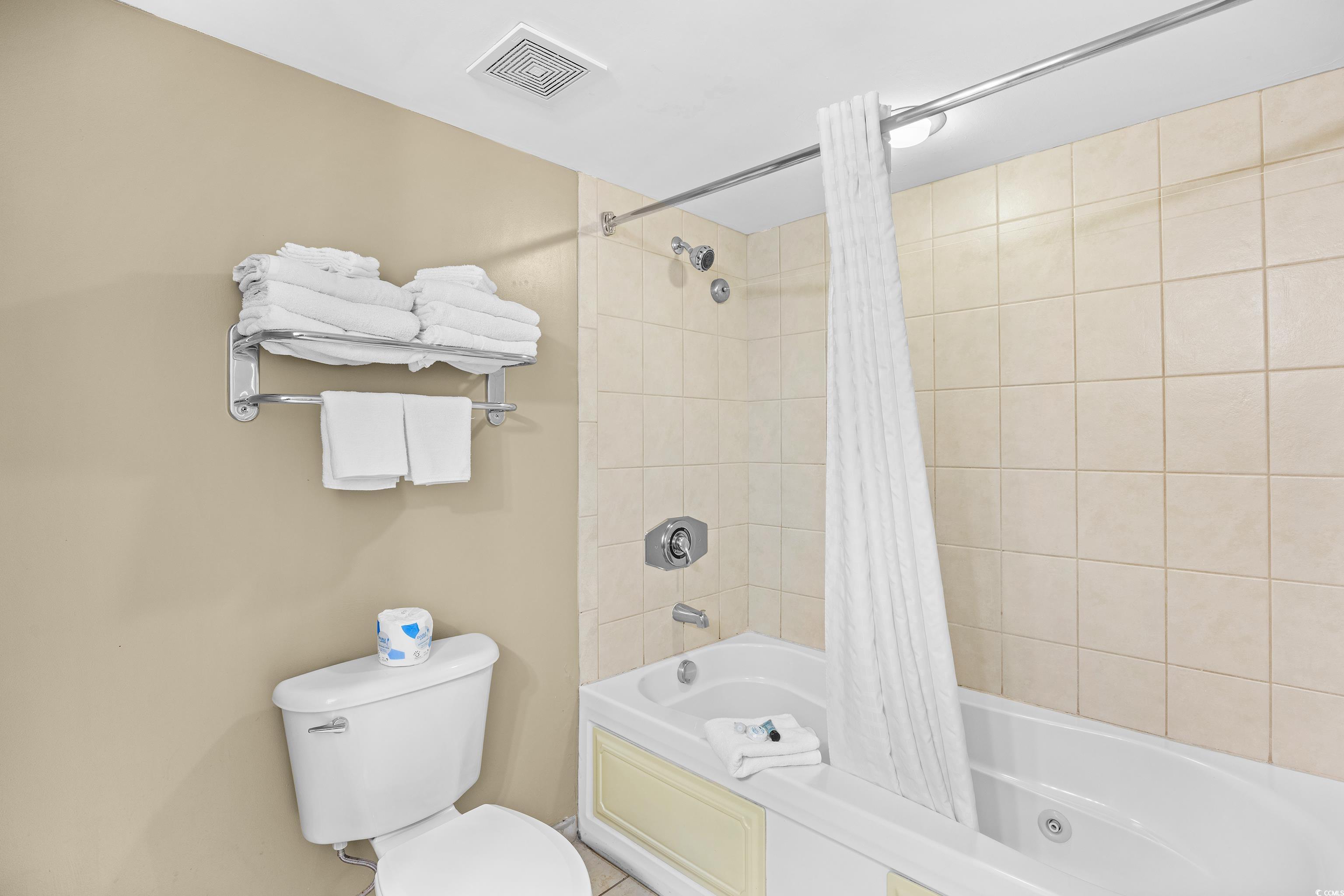 107 Ocean Boulevard, Unit 1402 Myrtle Beach, SC 29577 - Photo 24 of 38 Bathroom with toilet, shower / bath combo, and visible vents