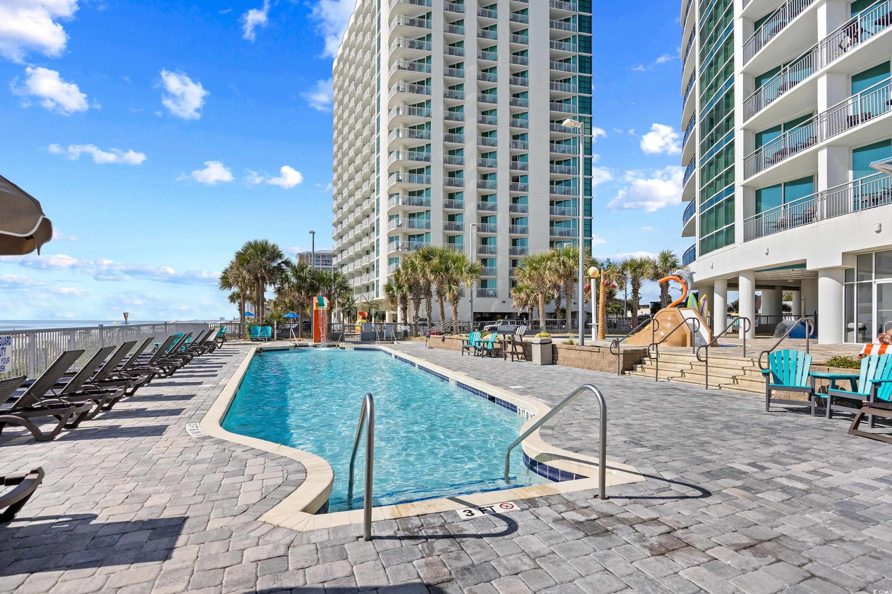 107 Ocean Boulevard, Unit 1402 Myrtle Beach, SC 29577 - Photo 29 of 38 Community pool featuring a patio