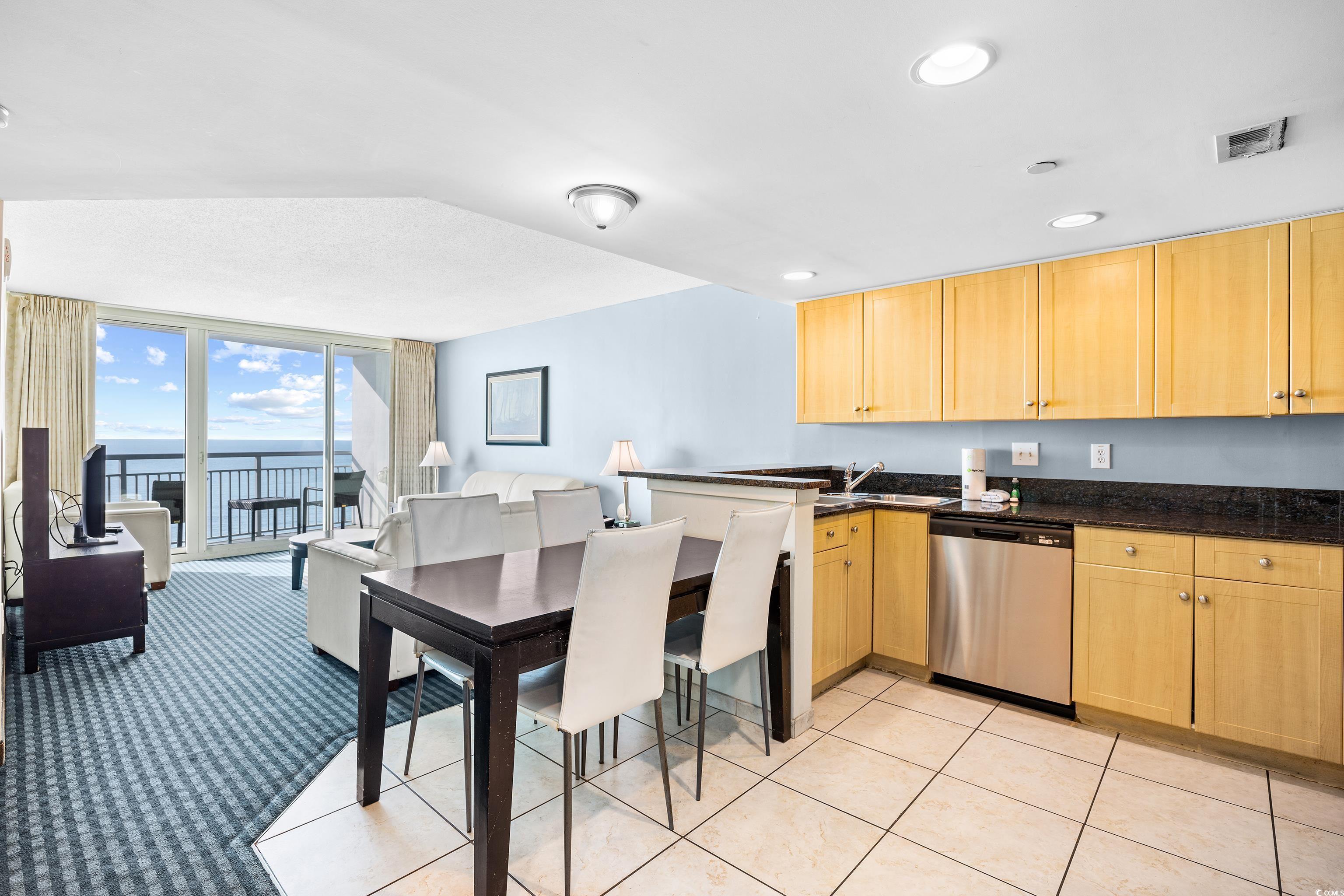107 Ocean Boulevard, Unit 1402 Myrtle Beach, SC 29577 - Photo 5 of 38 Kitchen with a peninsula, light brown cabinetry, visible vents, and dishwasher