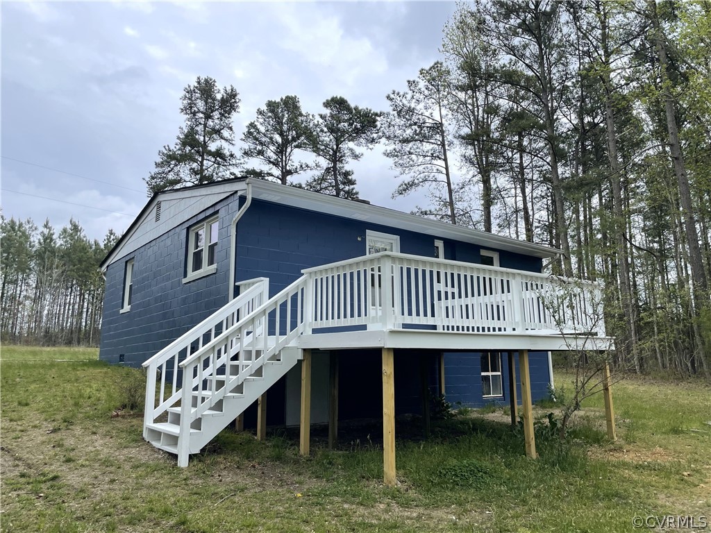 228 Beech Forest Road Kenbridge, VA 23944 - Photo 6 of 23 a view of a house with a deck and a yard
