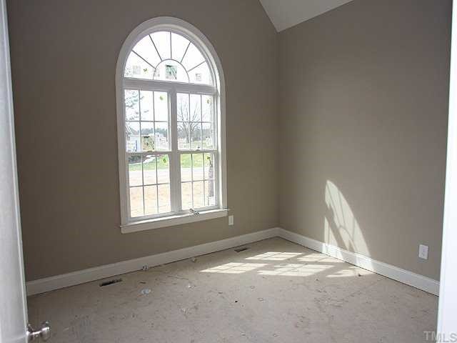 1405 Silver Farm Road Raleigh, NC 27603 - Photo 8 of 12 an empty room with a window