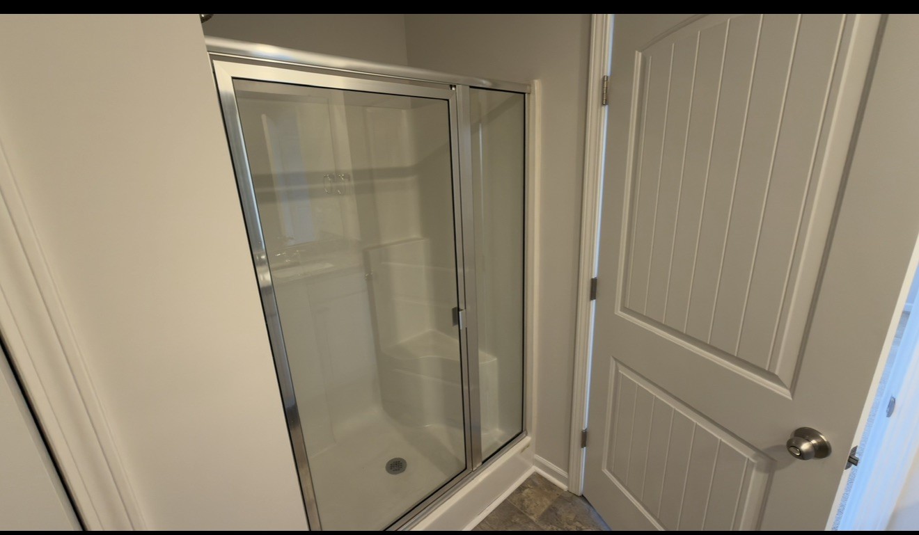 529 Ellen Road Lebanon, TN 37087 - Photo 16 of 17 a bathroom with a glass door shower and vanity