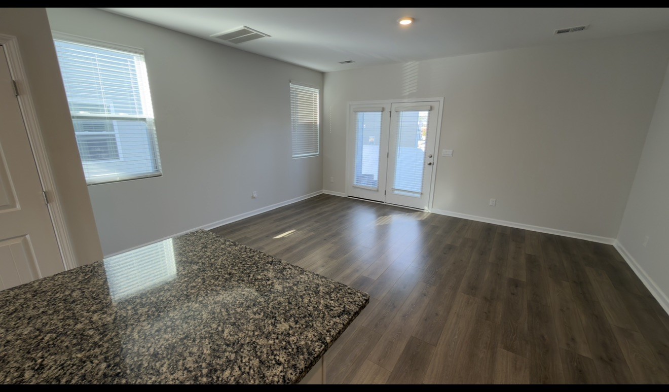 529 Ellen Road Lebanon, TN 37087 - Photo 5 of 17 an empty room with wooden floor and windows