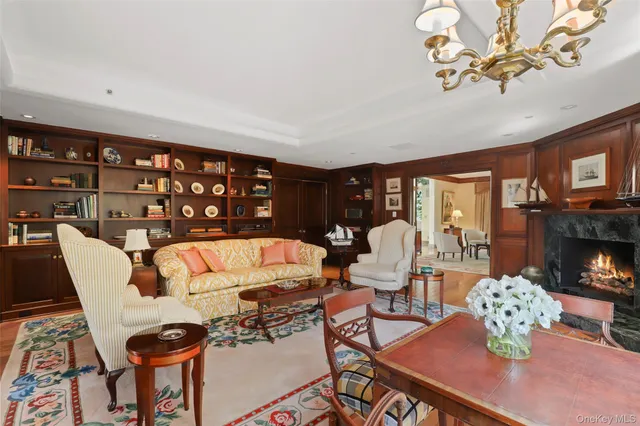 a living room with furniture and large windows