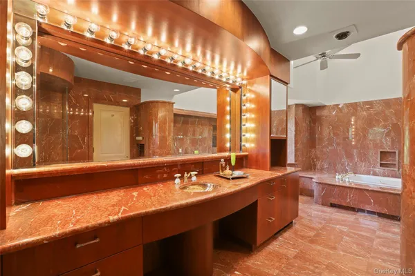 a kitchen with stainless steel appliances granite countertop a sink and a refrigerator