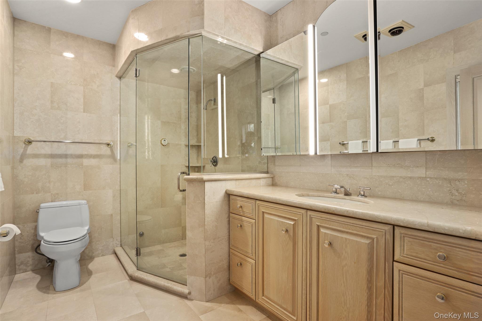 7 Rockledge Road Rye, NY 10580 - Photo 29 of 49 a bathroom with a granite countertop sink a toilet and shower