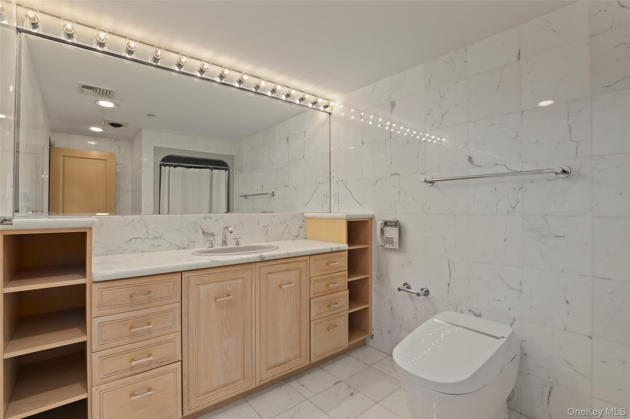 7 Rockledge Road Rye, NY 10580 - Photo 31 of 49 a bathroom with a granite countertop toilet sink and mirror