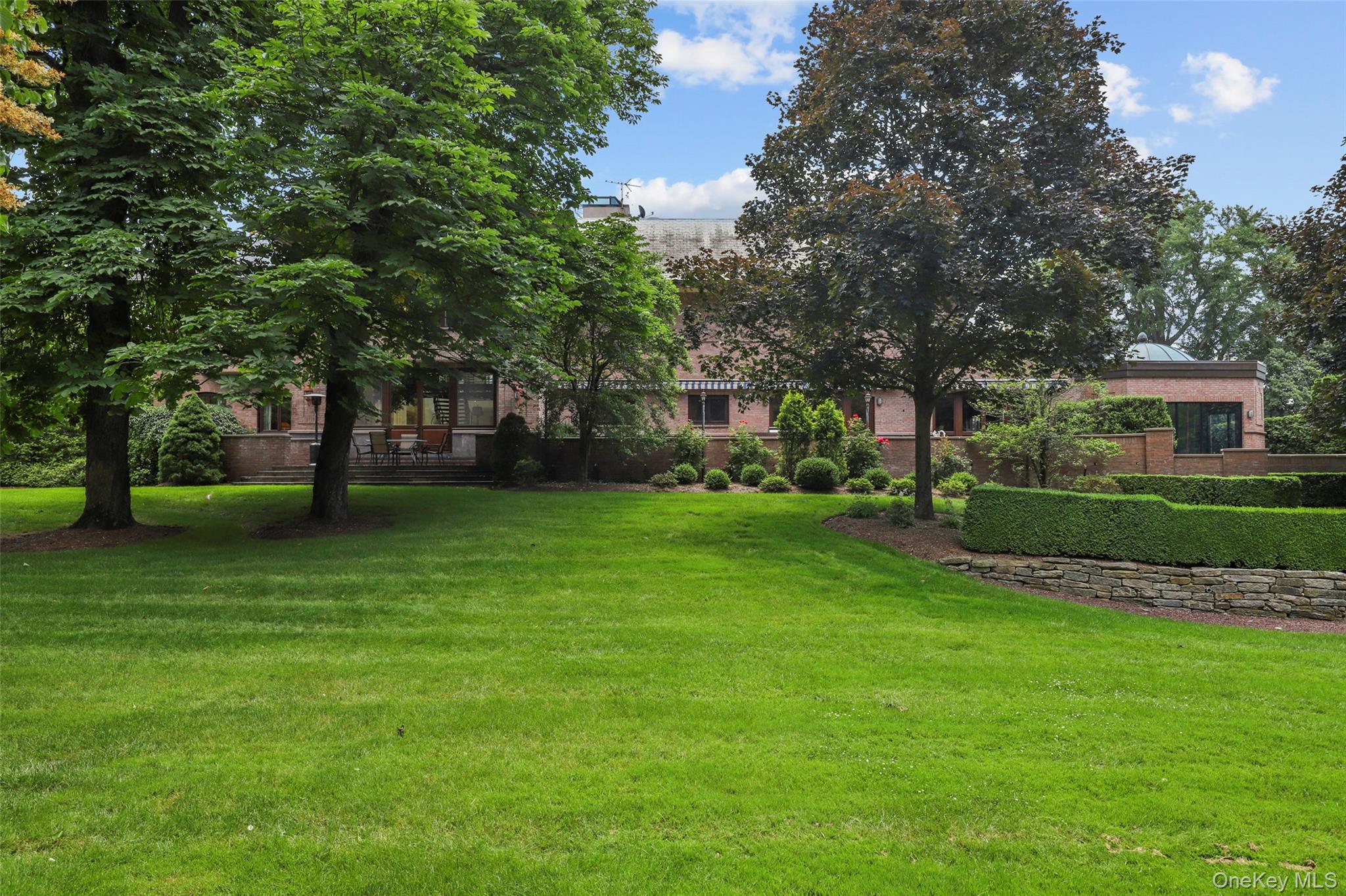 7 Rockledge Road Rye, NY 10580 - Photo 37 of 49 a view of house with a garden
