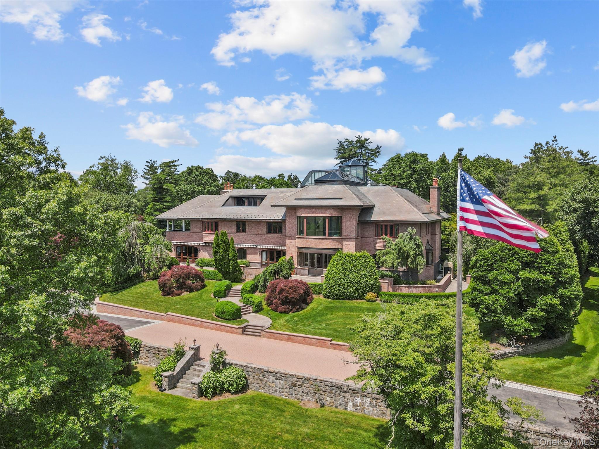 7 Rockledge Road Rye, NY 10580 - Photo 45 of 49 a front view of a house with a yard and fountain