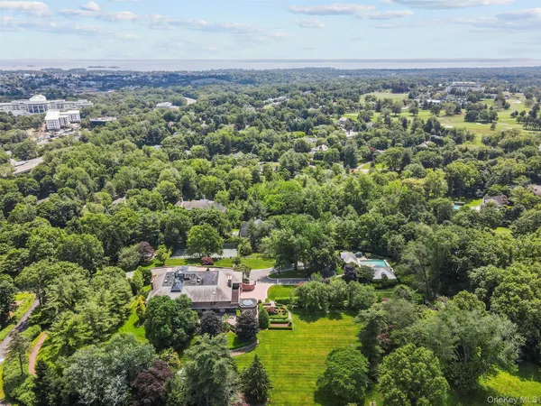 an aerial view of residential houses with city view