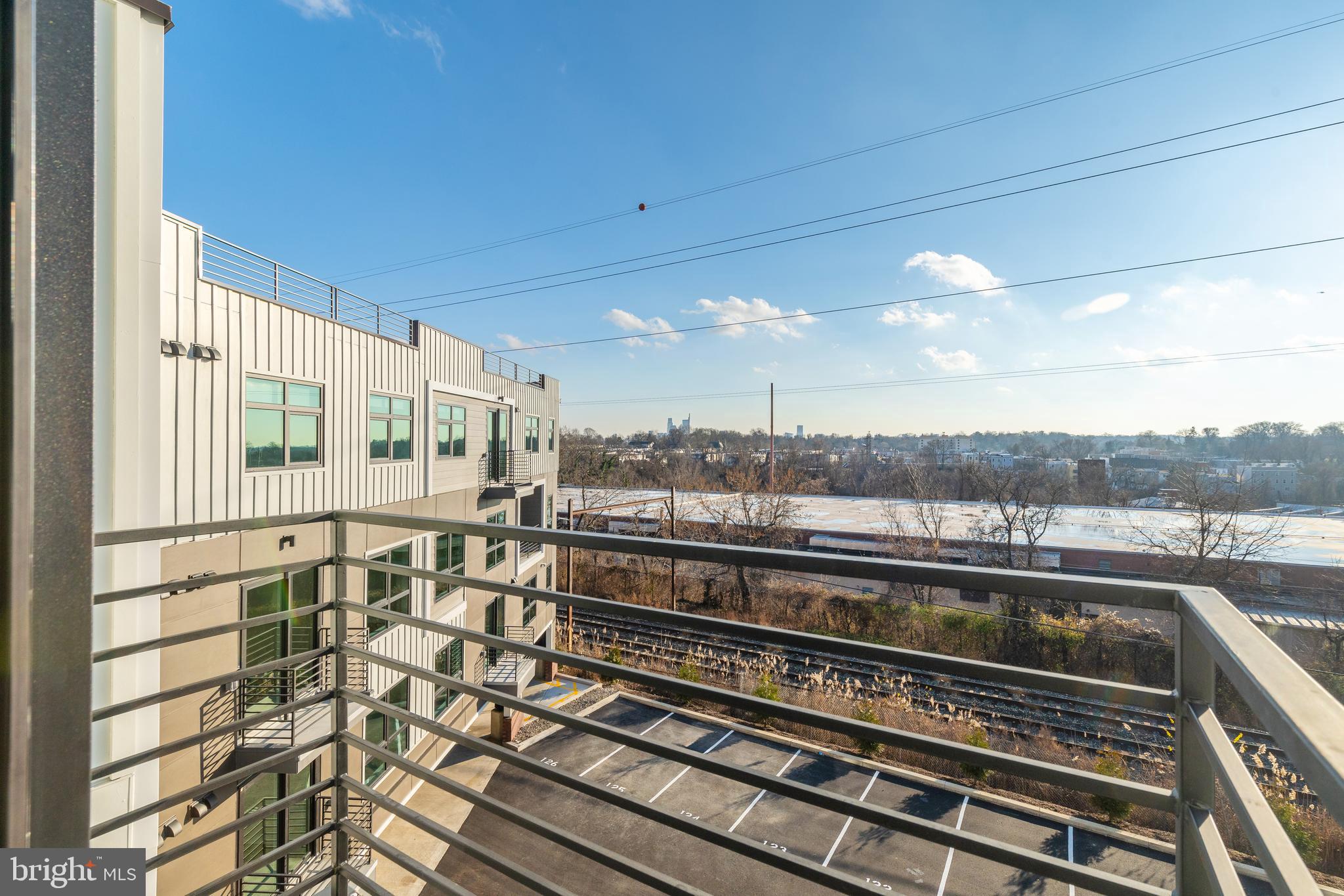 3449 Scotts Lane, Unit B413 Philadelphia, PA 19129 - Photo 11 of 17 a view of a balcony next to a yard