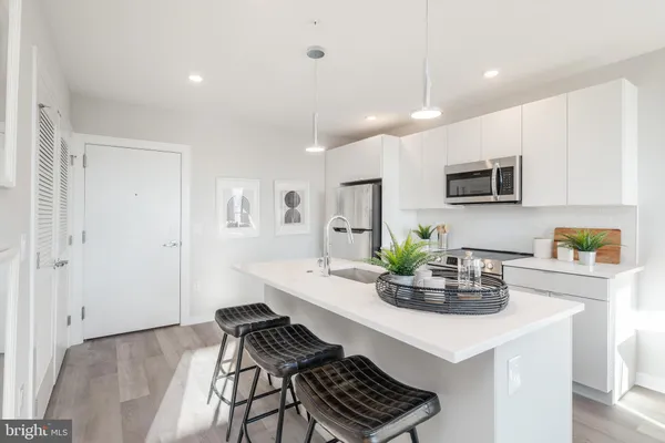 a kitchen with a table and chairs in it