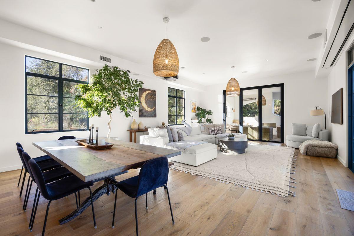 13202 Ojai Road Santa Paula, CA 93060 - Photo 12 of 50 a view of a dining room with furniture window and wooden floor