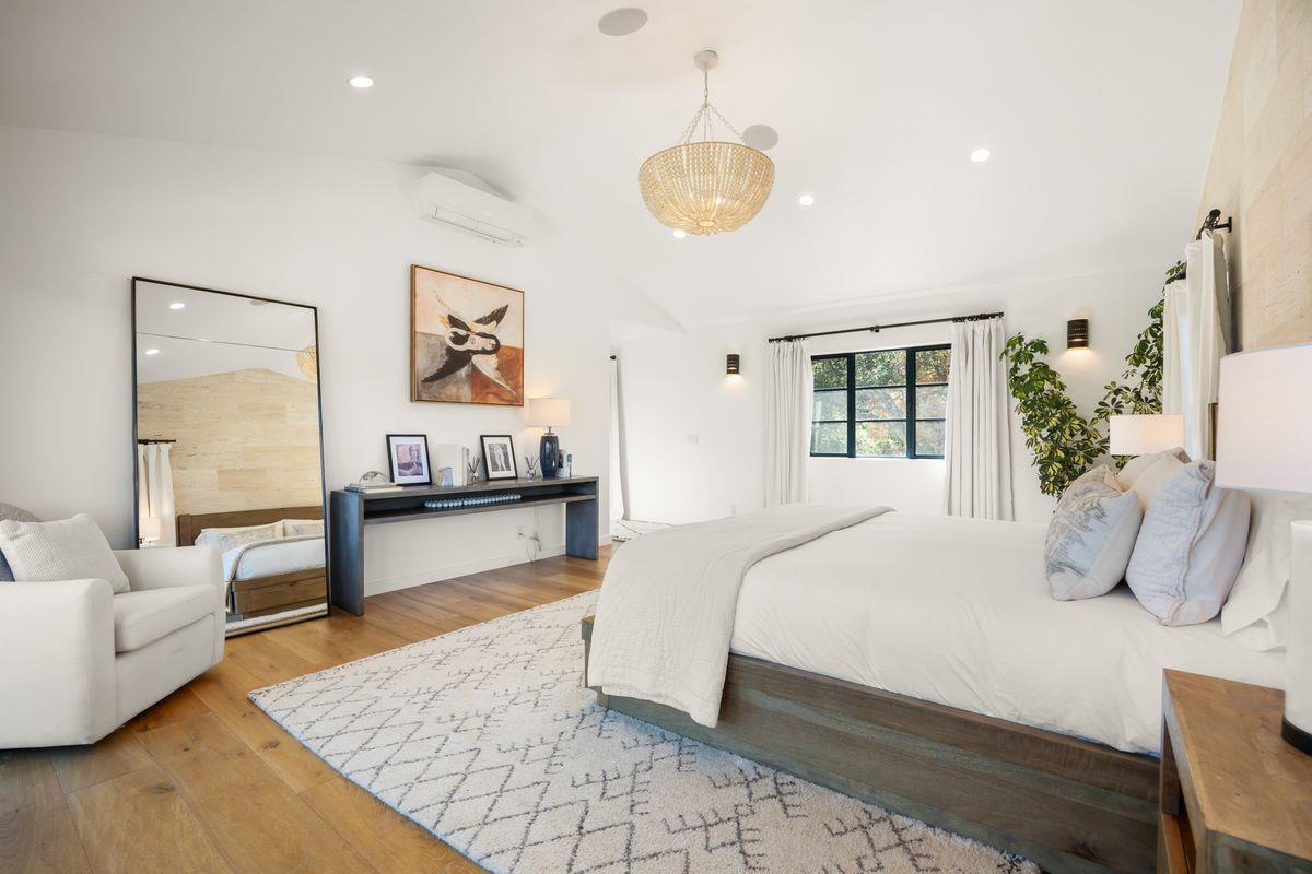 13202 Ojai Road Santa Paula, CA 93060 - Photo 22 of 50 a bedroom with a large bed and a couch