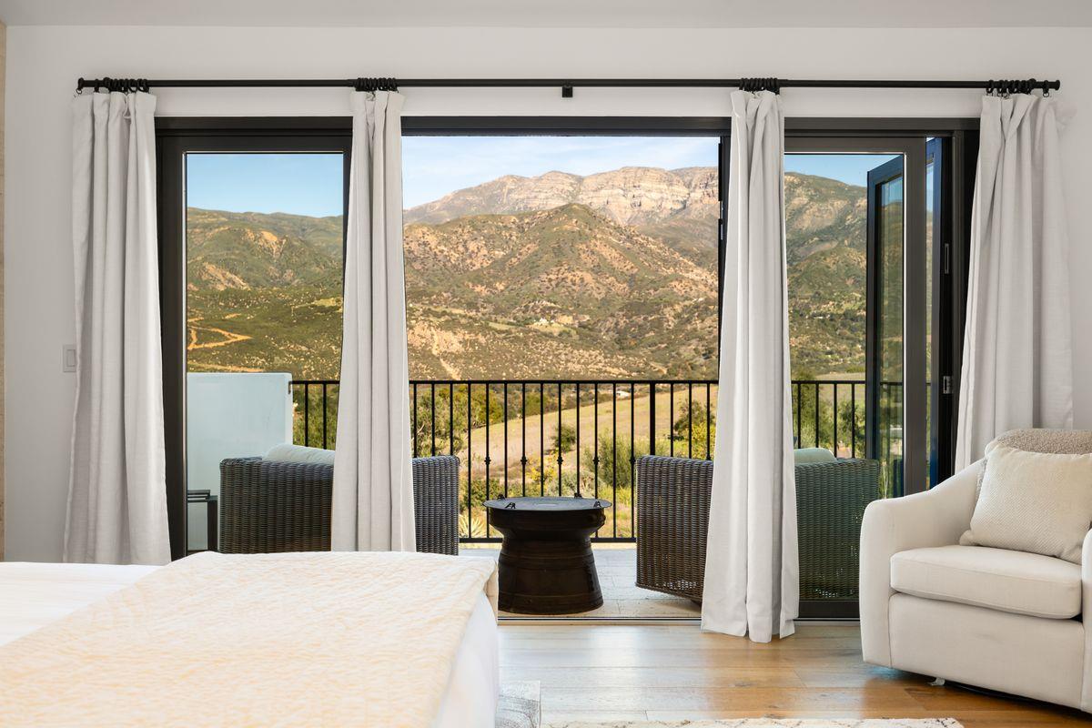 13202 Ojai Road Santa Paula, CA 93060 - Photo 23 of 50 a large living room with a large window and a couch