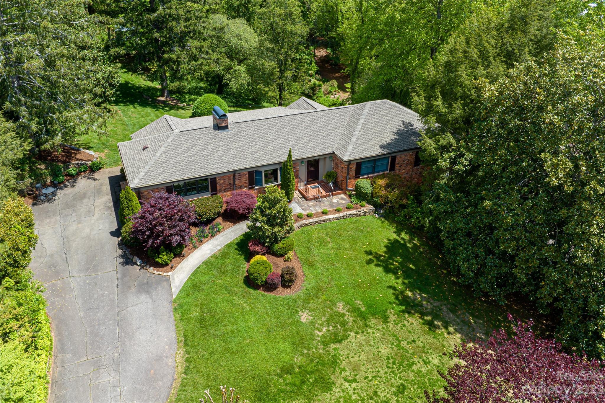 12 Club View Road Asheville, NC 28804 - Photo 1 of 47 a front view of a house with garden
