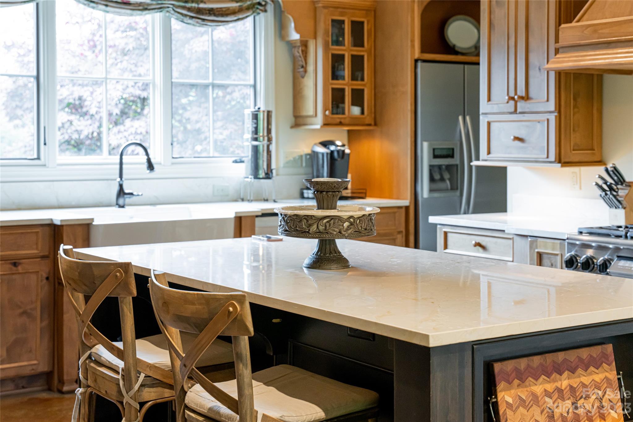 12 Club View Road Asheville, NC 28804 - Photo 11 of 47 a kitchen with a sink a counter and chairs