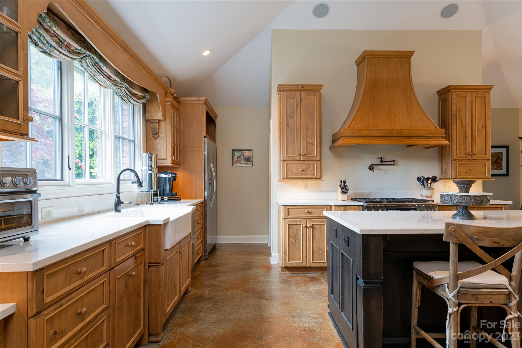12 Club View Road Asheville, NC 28804 - Photo 15 of 47 a kitchen with stainless steel appliances a sink stove and cabinets