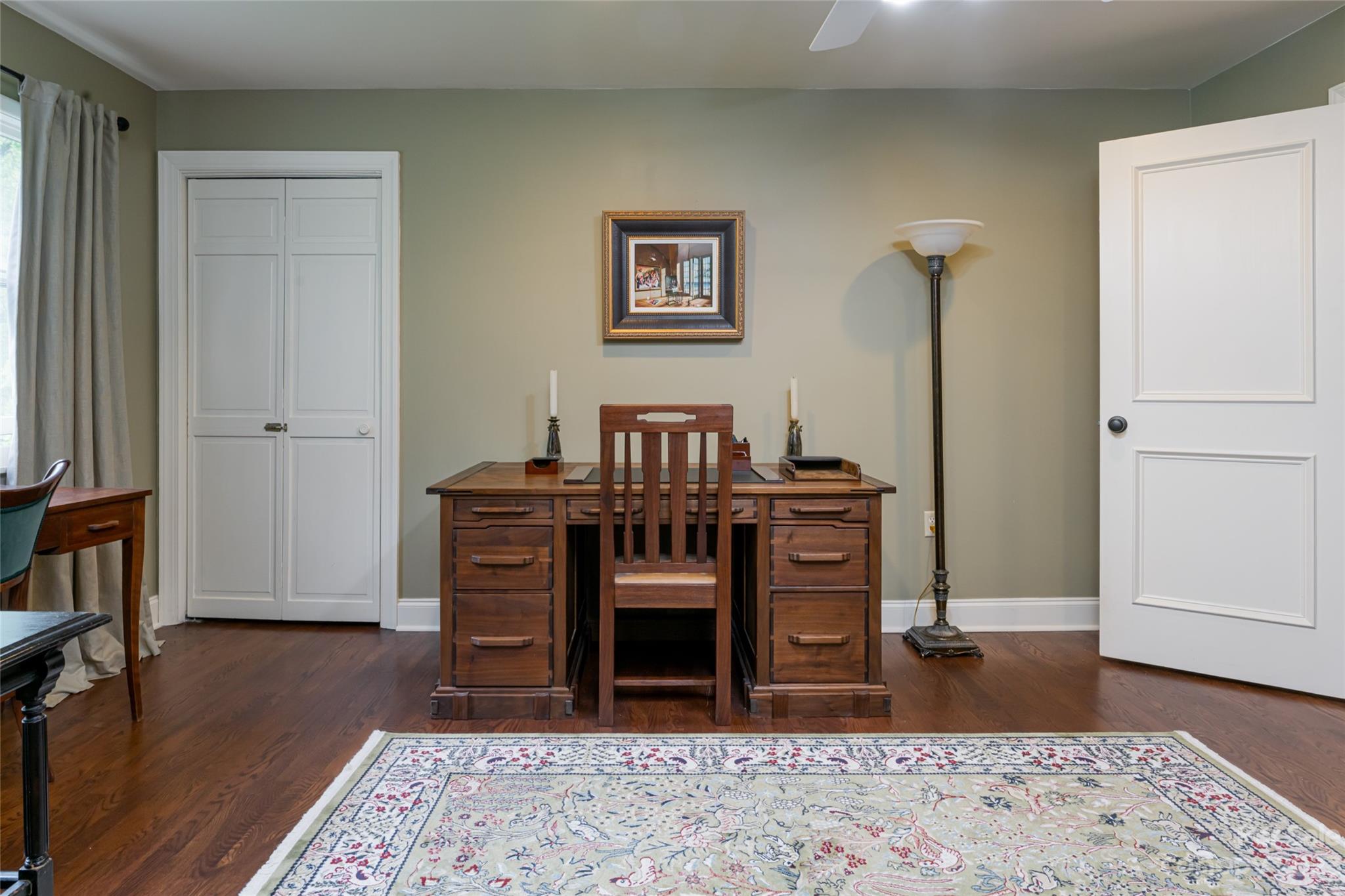 12 Club View Road Asheville, NC 28804 - Photo 20 of 47 a view of a bedroom with furniture and wooden floor