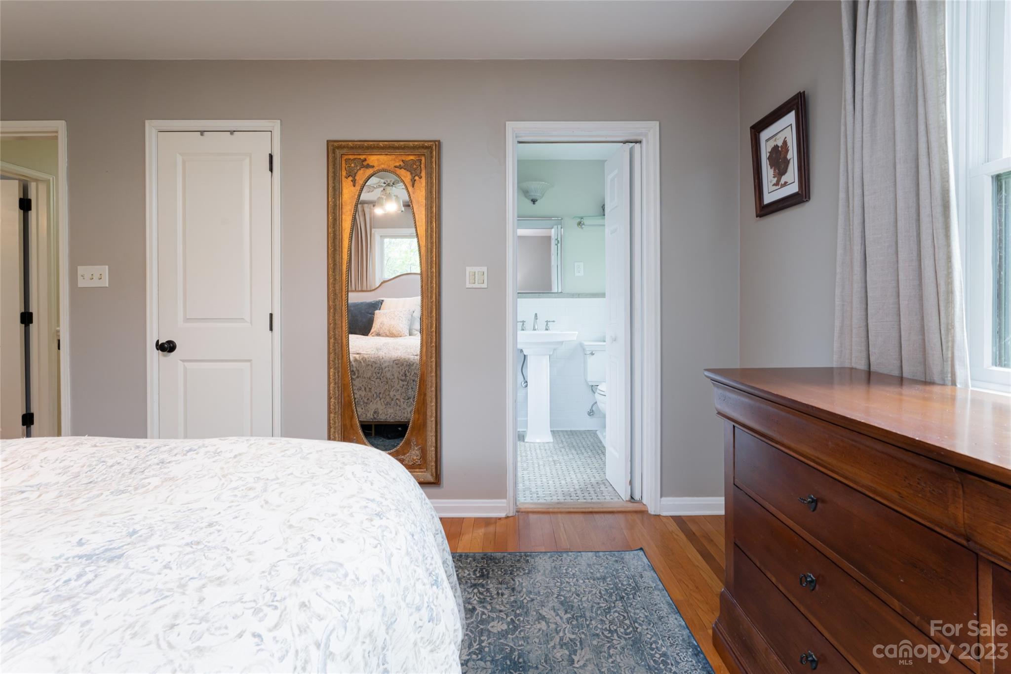 12 Club View Road Asheville, NC 28804 - Photo 22 of 47 a bedroom with a bed and a dresser