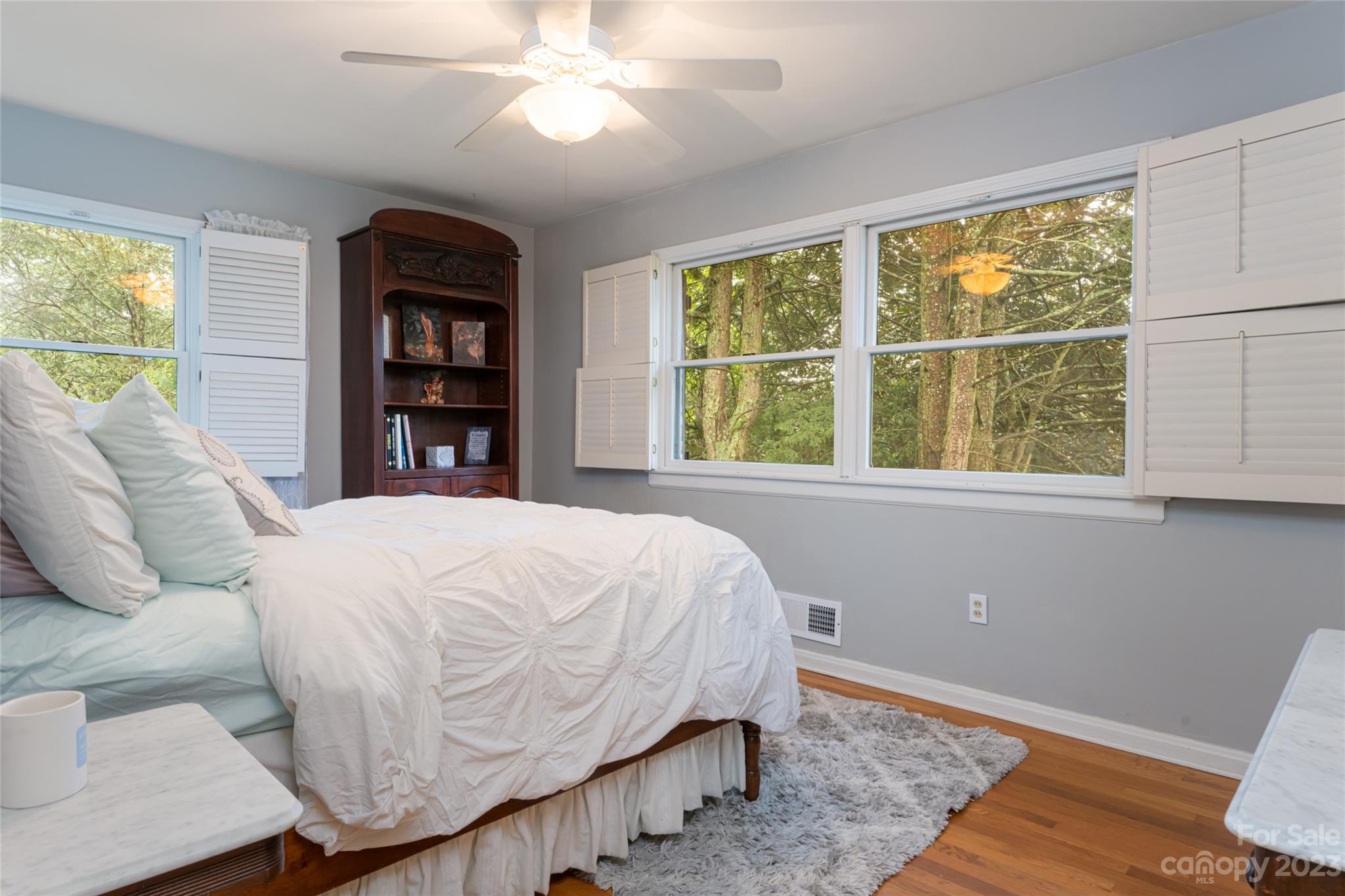 12 Club View Road Asheville, NC 28804 - Photo 26 of 47 a bed sitting in a bedroom next to a window