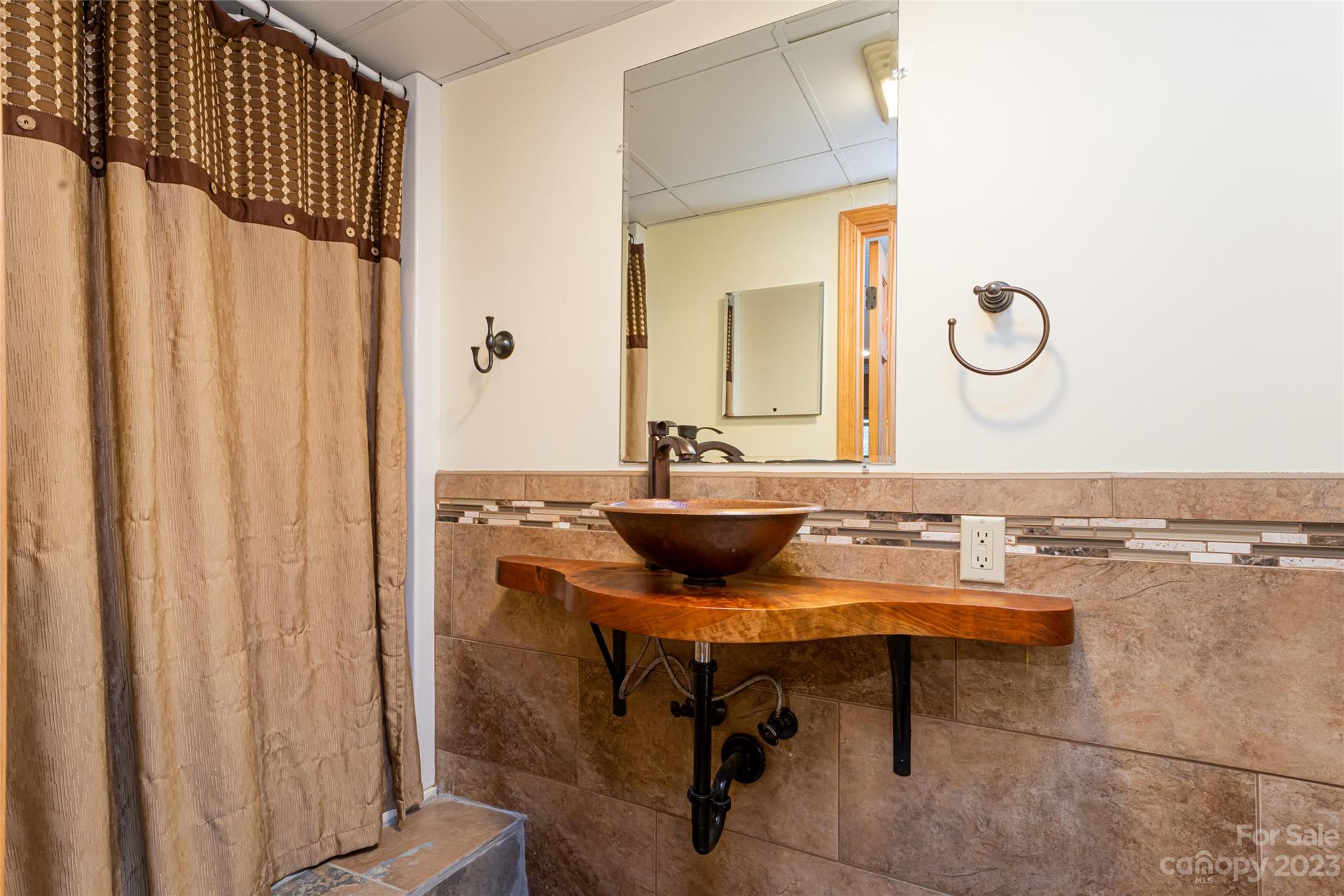12 Club View Road Asheville, NC 28804 - Photo 35 of 47 a view of a bathroom with sink mirror and wooden table