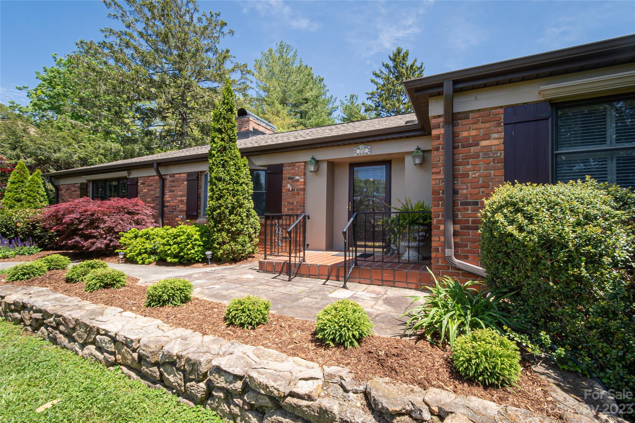 12 Club View Road Asheville, NC 28804 - Photo 4 of 47 a view of a chair and table and potted in front of house