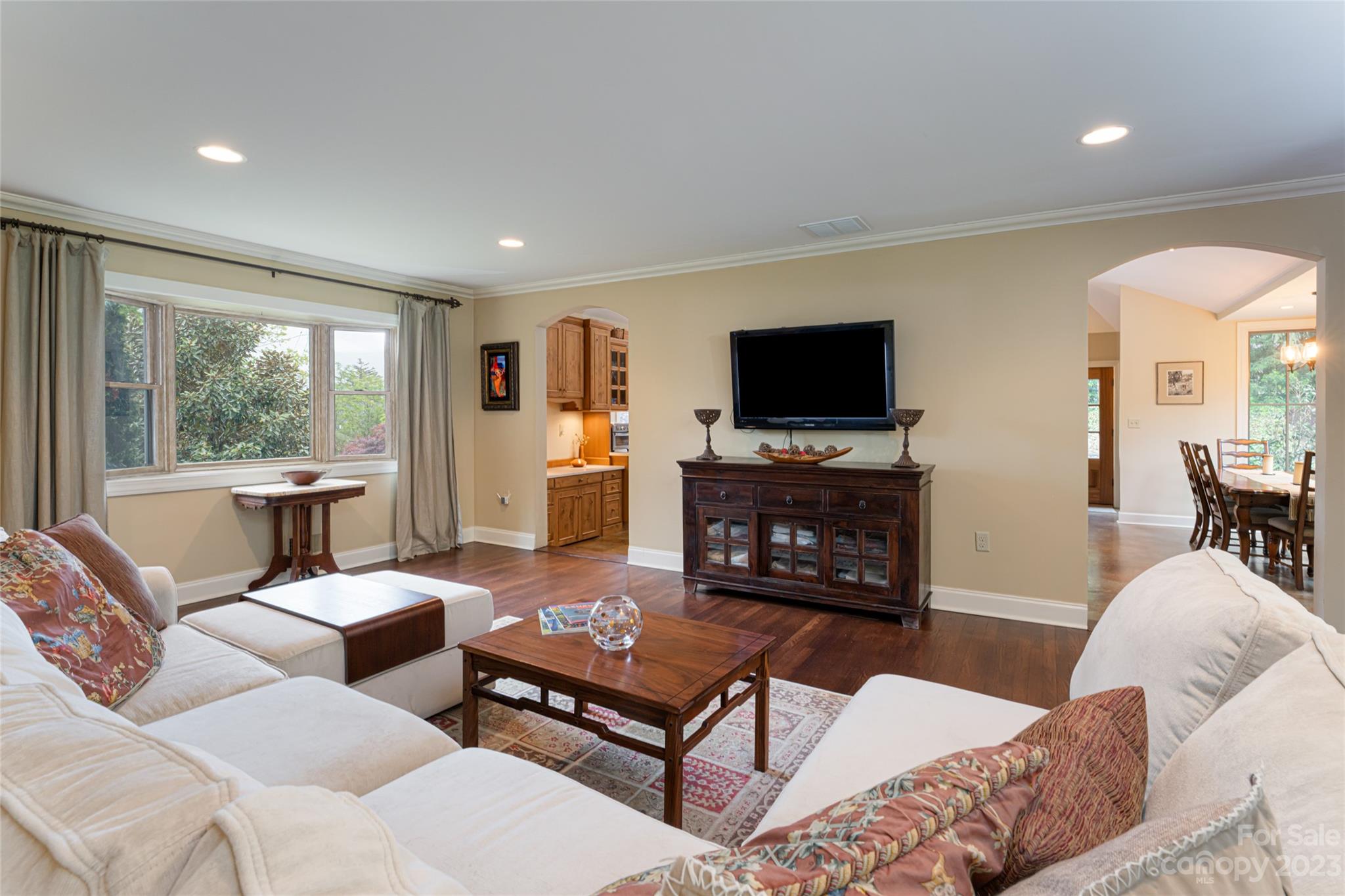 12 Club View Road Asheville, NC 28804 - Photo 6 of 47 a living room with furniture a flat screen tv and a fireplace