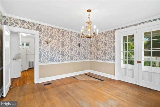 a view of a room with cabinet and wooden floor