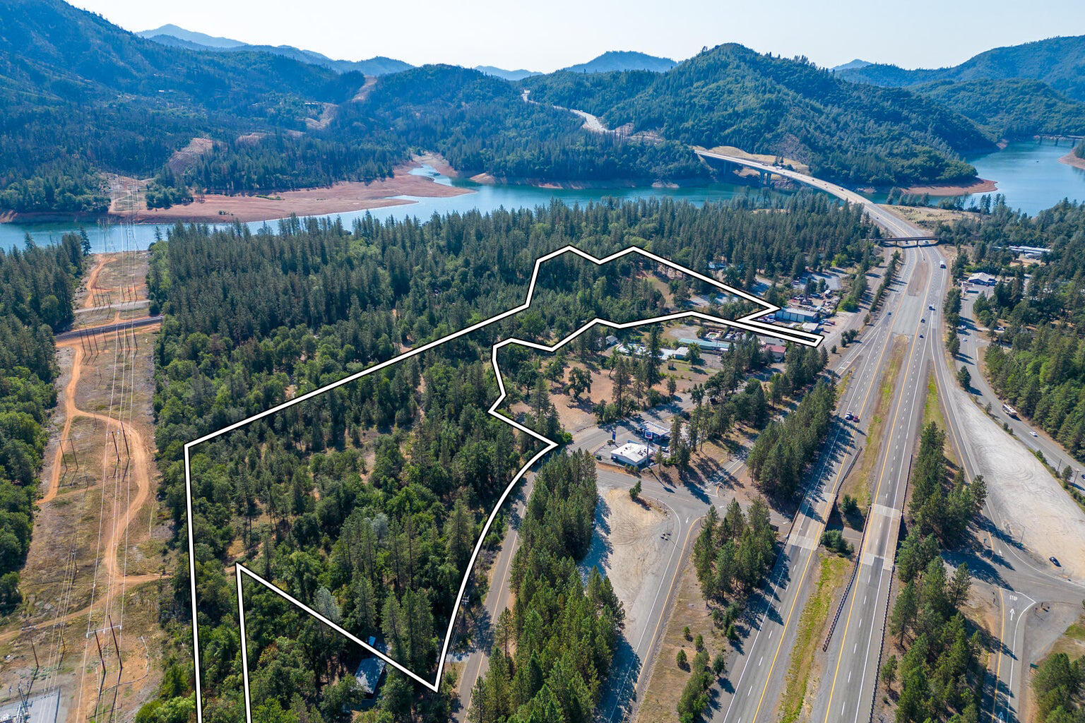 17 Acres In Lakehead Lakehead, CA 96051 - Photo 2 of 25 a view of a tennis court with a garden and a mountain