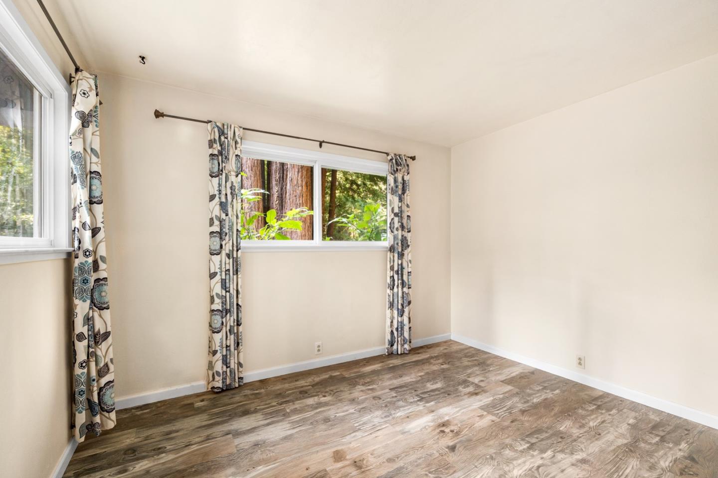 1000 Harmon Gulch Road Boulder Creek, CA 95006 - Photo 15 of 44 an empty room with windows