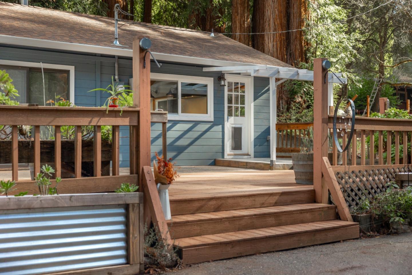 1000 Harmon Gulch Road Boulder Creek, CA 95006 - Photo 21 of 44 a view of a house with a porch