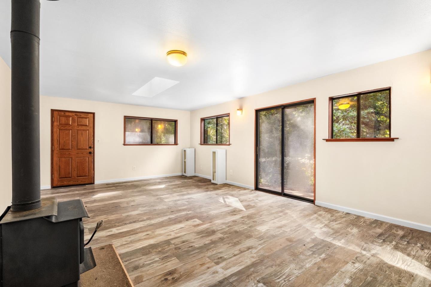 1000 Harmon Gulch Road Boulder Creek, CA 95006 - Photo 28 of 44 a view of an empty room with window and wooden floor