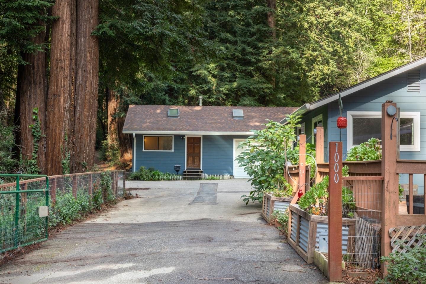 1000 Harmon Gulch Road Boulder Creek, CA 95006 - Photo 39 of 44 a front view of a house with garden