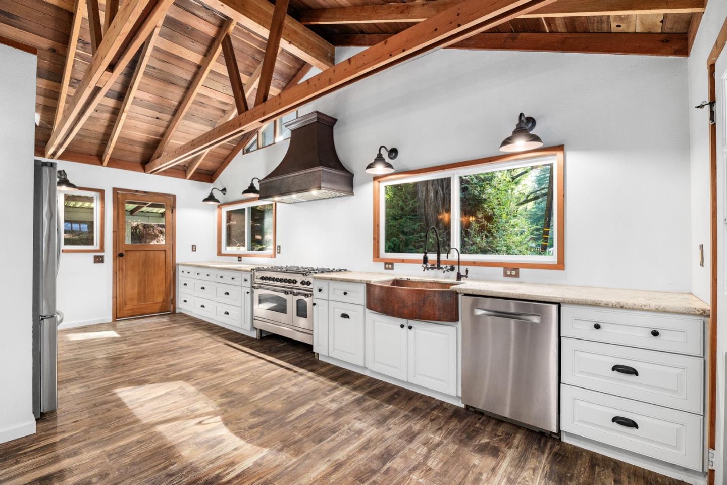 1000 Harmon Gulch Road Boulder Creek, CA 95006 - Photo 4 of 44 a large kitchen with cabinets