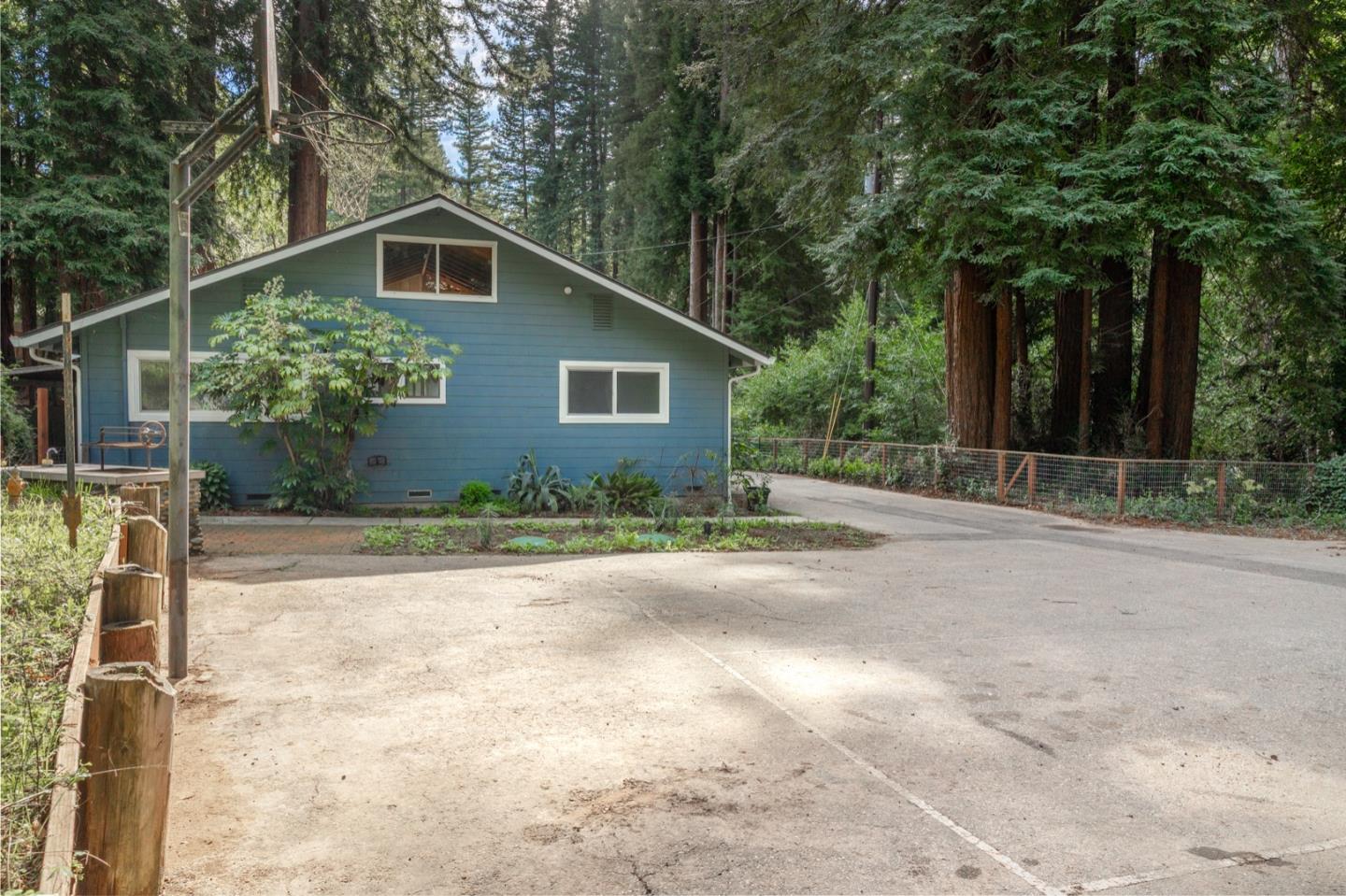 1000 Harmon Gulch Road Boulder Creek, CA 95006 - Photo 42 of 44 a front view of a house with a yard and trees