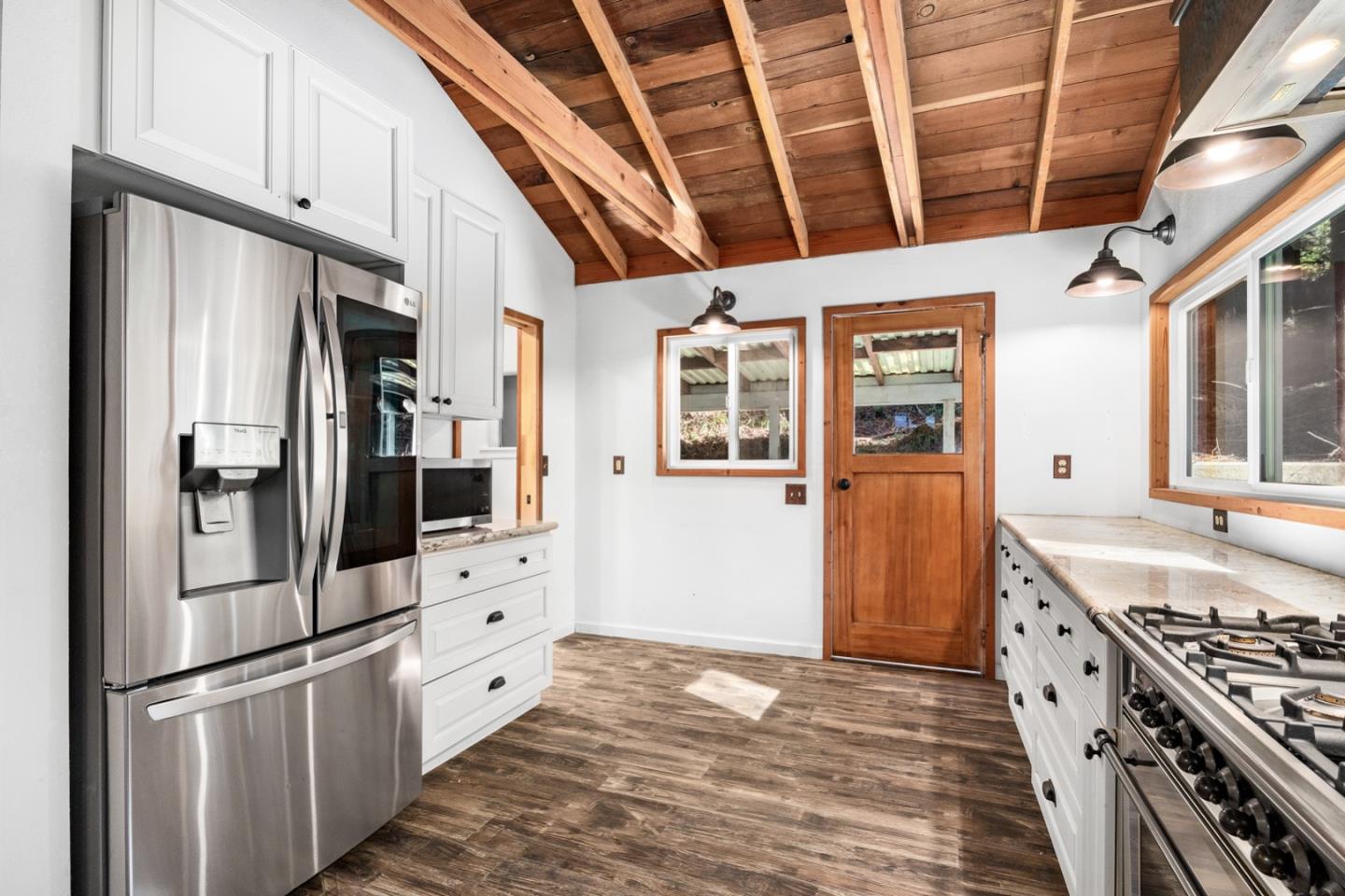 1000 Harmon Gulch Road Boulder Creek, CA 95006 - Photo 5 of 44 a kitchen with stainless steel appliances granite countertop a refrigerator and a stove
