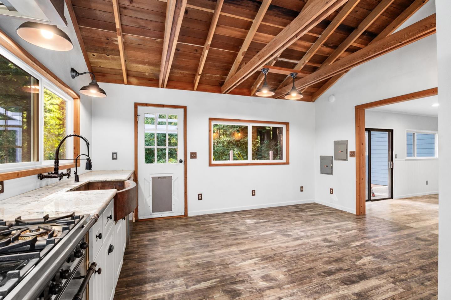 1000 Harmon Gulch Road Boulder Creek, CA 95006 - Photo 6 of 44 a kitchen with stainless steel appliances granite countertop a stove a sink and a refrigerator