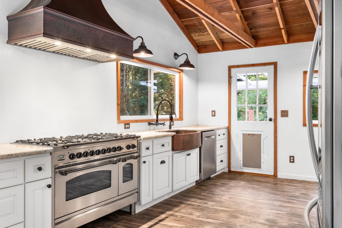 1000 Harmon Gulch Road Boulder Creek, CA 95006 - Photo 7 of 44 a kitchen with stainless steel appliances a stove a sink and a refrigerator
