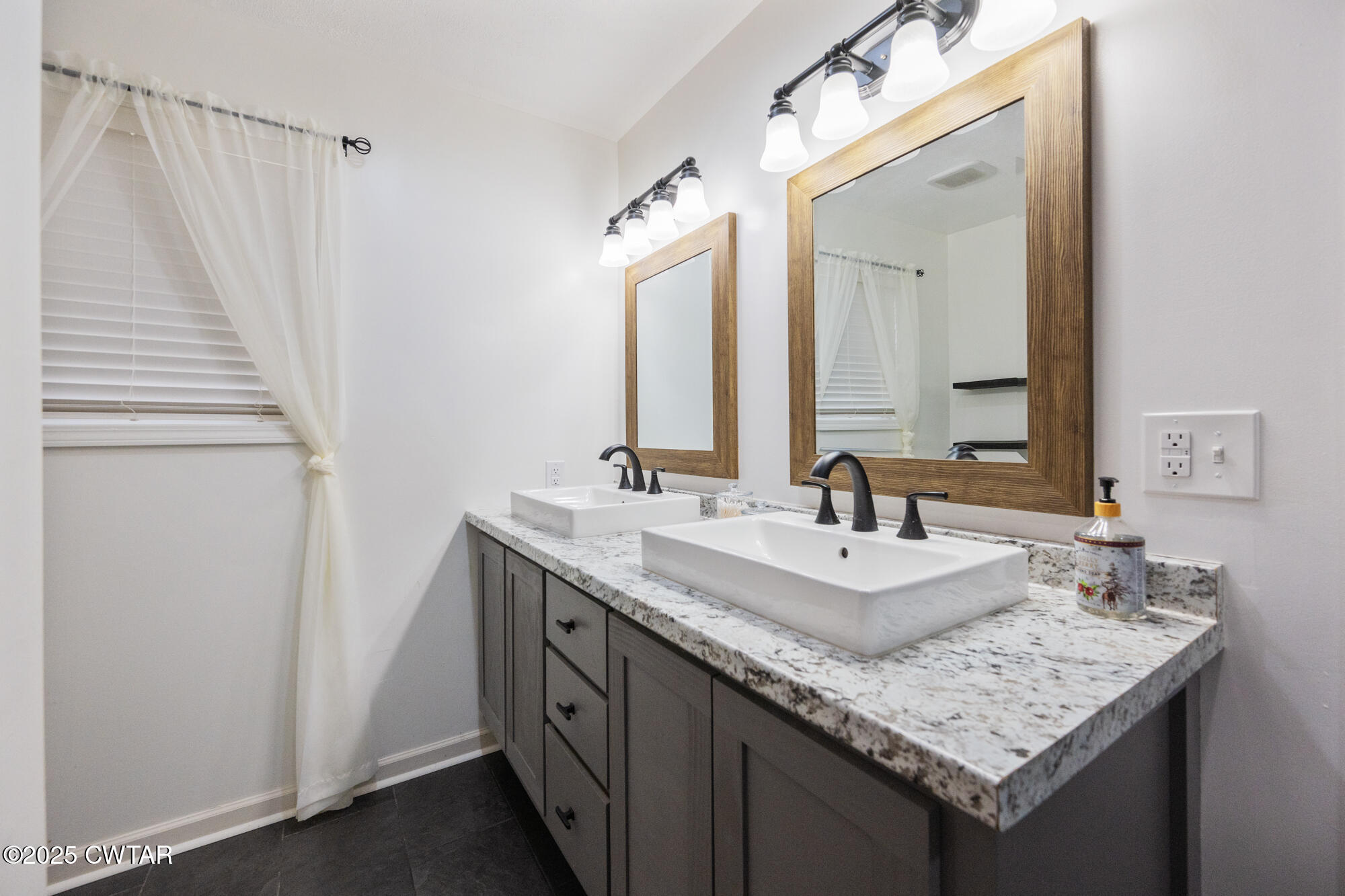 2250 Crucifer Road Huron, TN 38345 - Photo 17 of 32 a bathroom with a granite countertop sink and a mirror