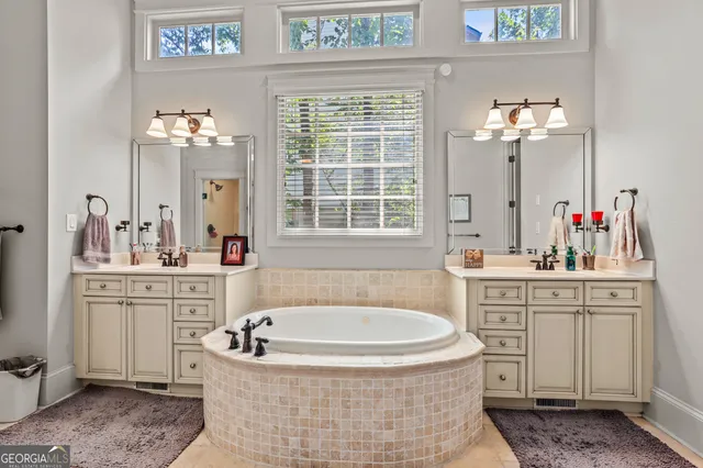 a bedroom with a bed a chair and dresser