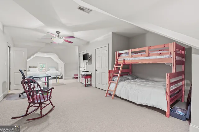 a view of a town with big trees